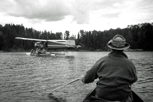 Wearing his late father's signature hat, "that damn Andy" and I paddle toward the De Havilland Beaver, serial number 0023, to greet and assist the rest of our party.
